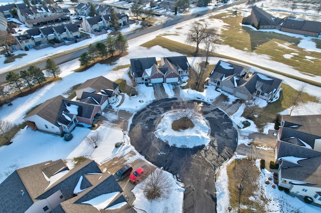 snowy aerial view featuring a residential view