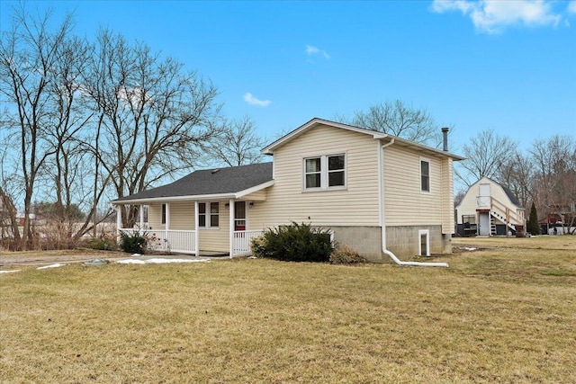 exterior space featuring covered porch and a front yard