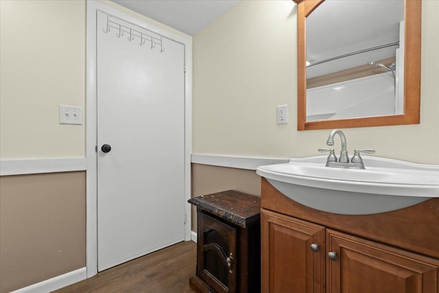 bathroom featuring vanity and wood finished floors