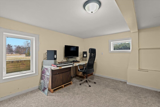 office featuring baseboards and light colored carpet