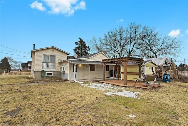 rear view of house with a yard and a pergola