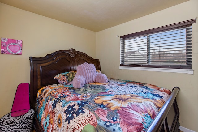 bedroom featuring baseboards