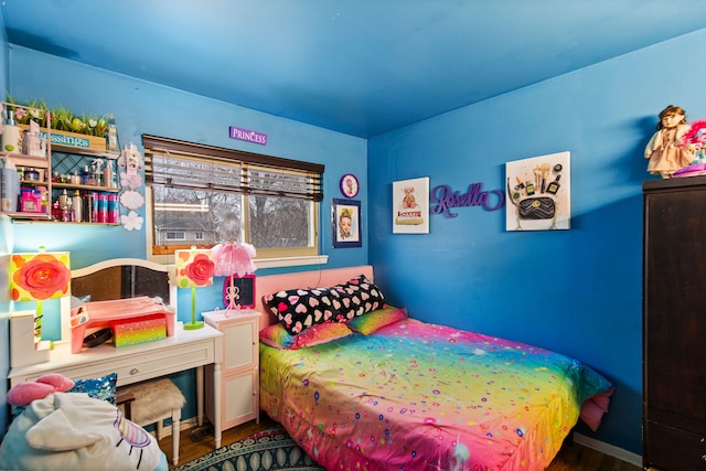 bedroom with wood finished floors