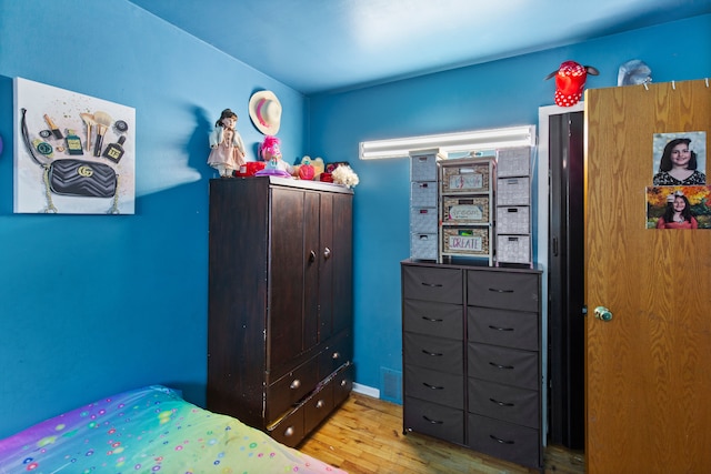 bedroom with wood finished floors