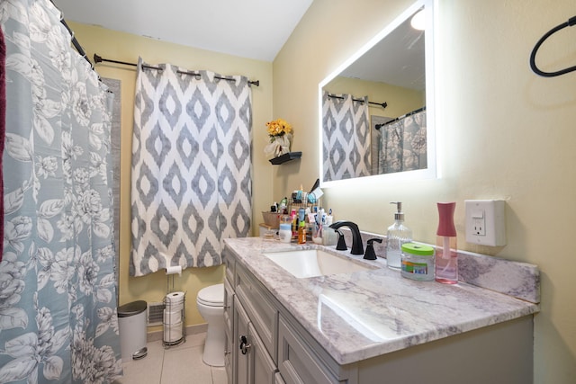 full bath featuring toilet, tile patterned flooring, and vanity