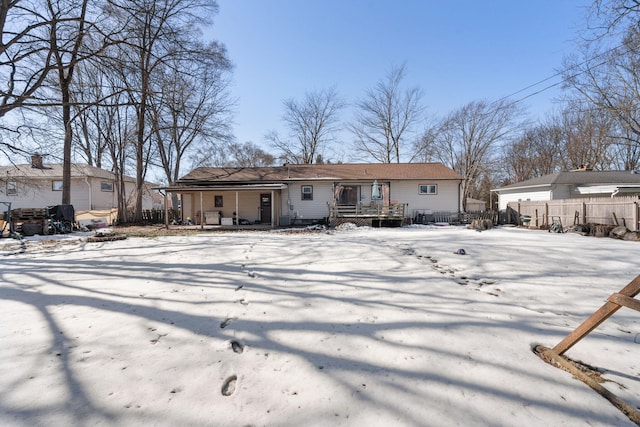 view of front of house featuring fence