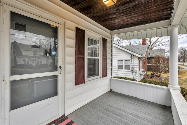 wooden deck featuring covered porch