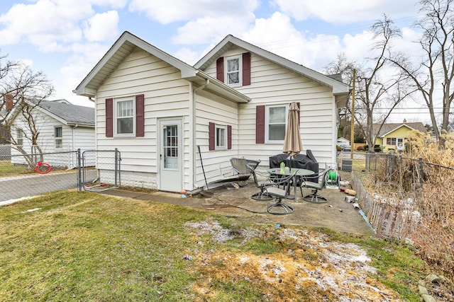 back of property featuring a patio area, a gate, a fenced backyard, and a yard