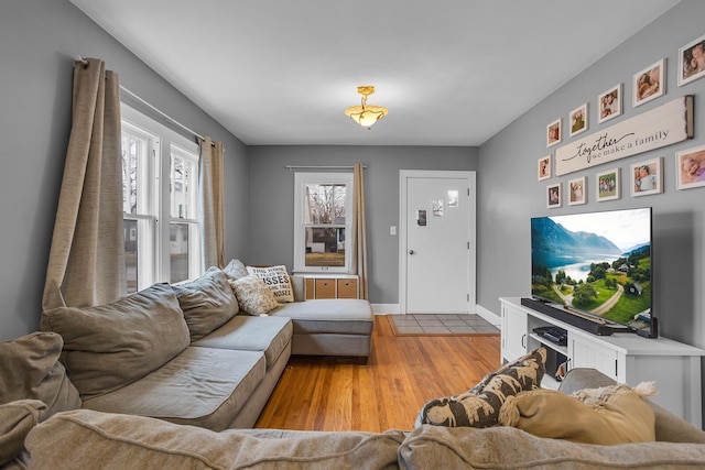 living room featuring light wood-style floors and baseboards