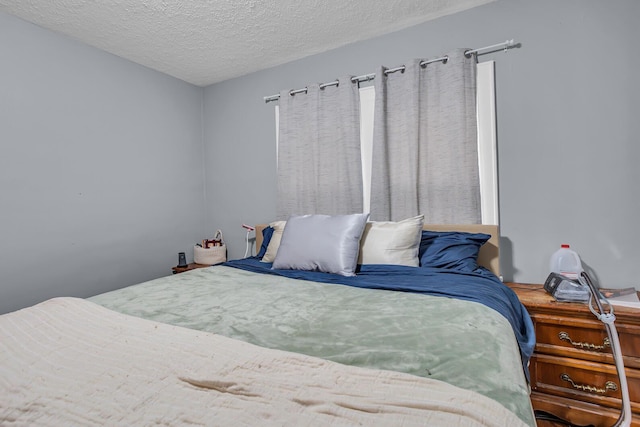 bedroom featuring a textured ceiling