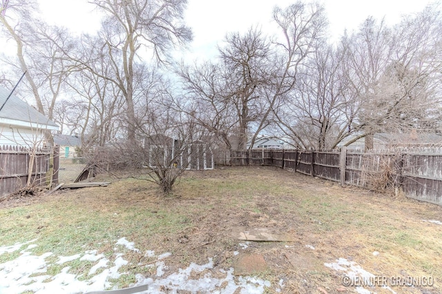 view of yard with a fenced backyard