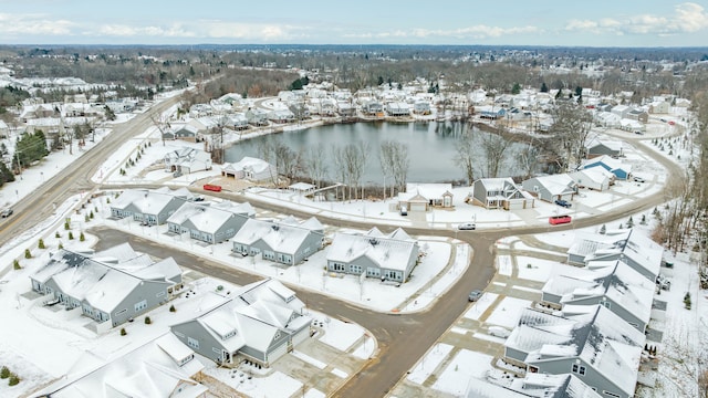 snowy aerial view with a residential view