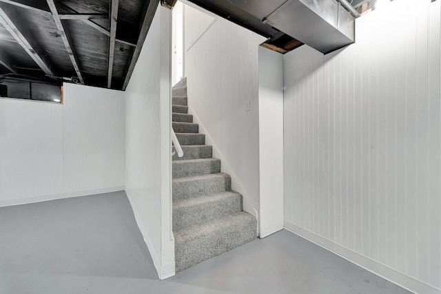 stairs featuring concrete floors