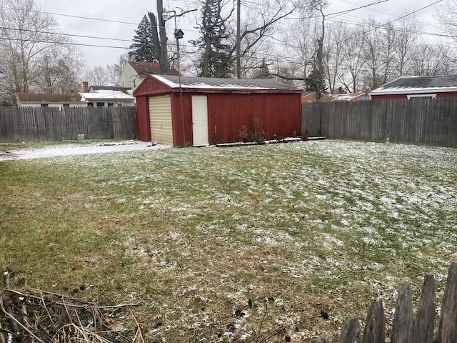 view of yard featuring a fenced backyard and an outbuilding