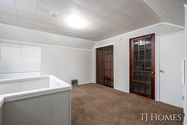 bonus room with vaulted ceiling, carpet, and visible vents