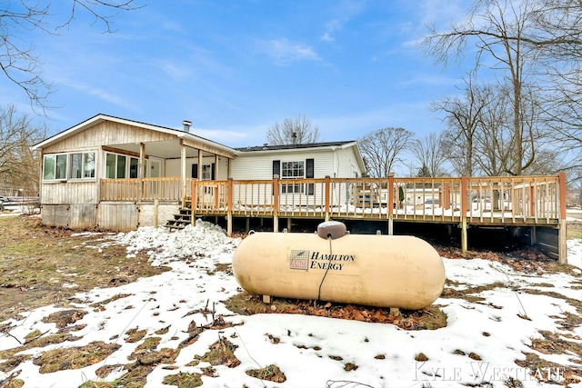 view of snow covered house