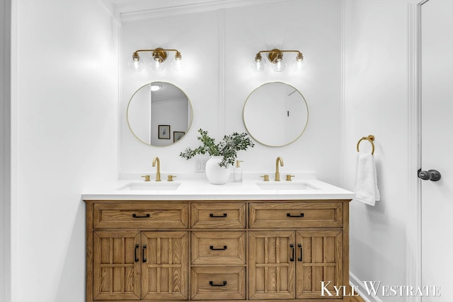 bathroom featuring a sink and double vanity