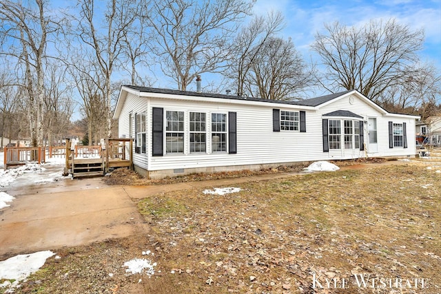 exterior space with crawl space and a deck