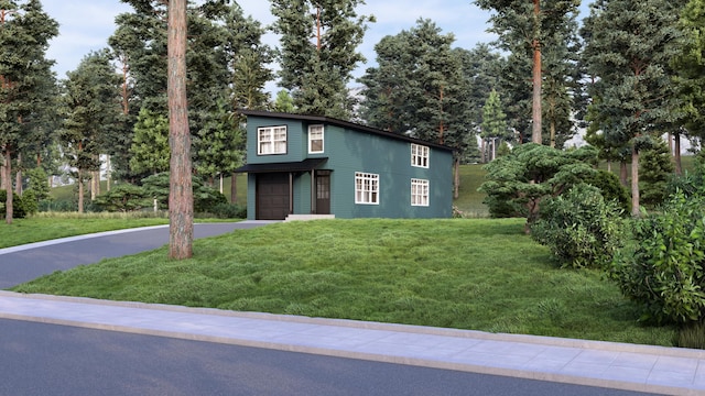 view of front of house featuring a garage, aphalt driveway, and a front lawn