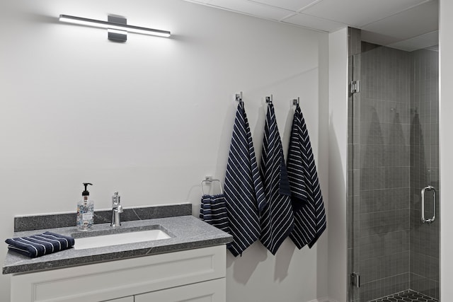 full bath with a shower stall and vanity