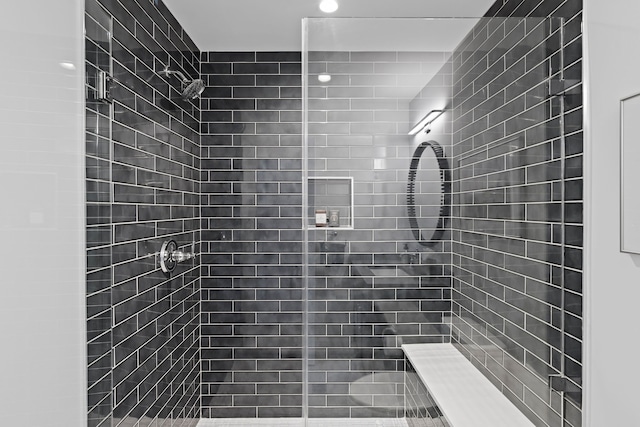 bathroom with a shower stall