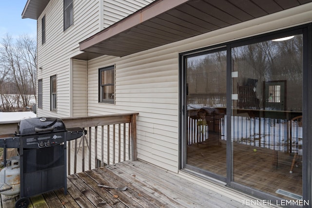 wooden terrace featuring grilling area