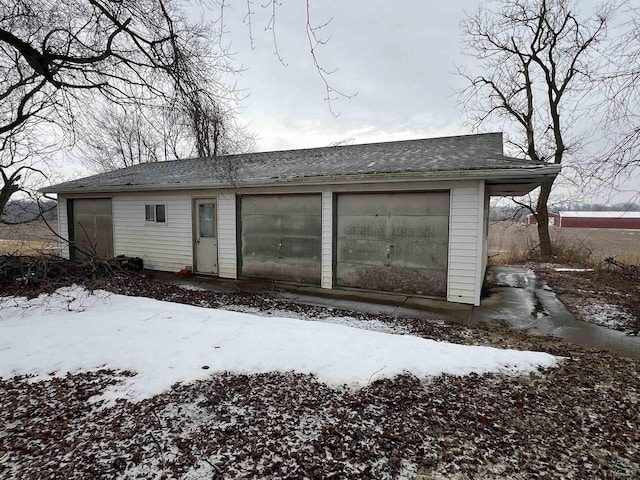 view of snow covered garage