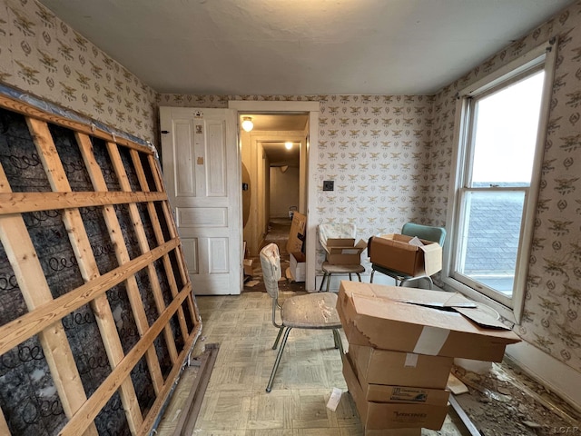 wine cellar featuring wallpapered walls