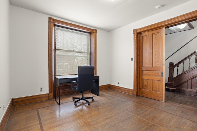 office with wood-type flooring and baseboards