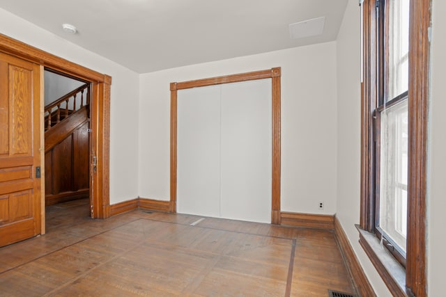 empty room with baseboards