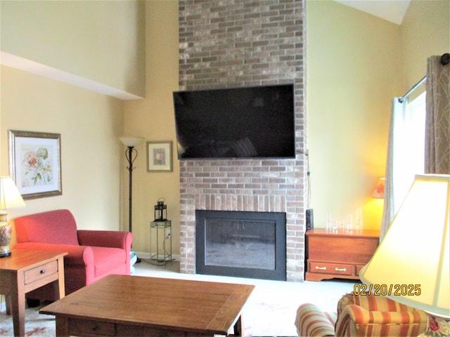 living room featuring a brick fireplace