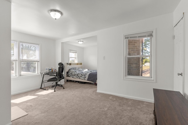 bedroom with carpet and baseboards