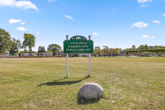 view of home's community with a yard