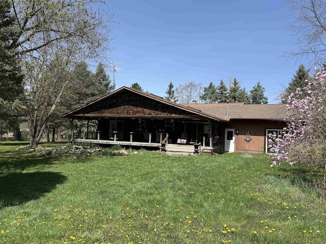 5235 Lahring Rd, Linden, MI 48451 - back of house with a lawn