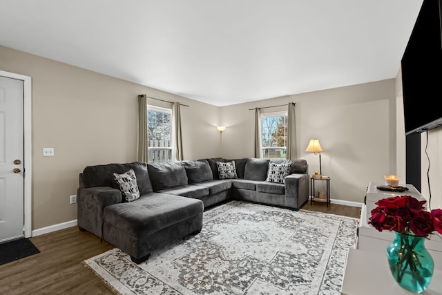 living area featuring wood finished floors and baseboards