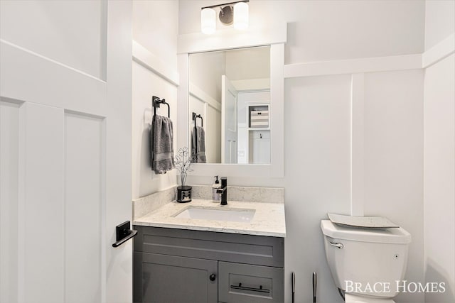 bathroom with vanity and toilet