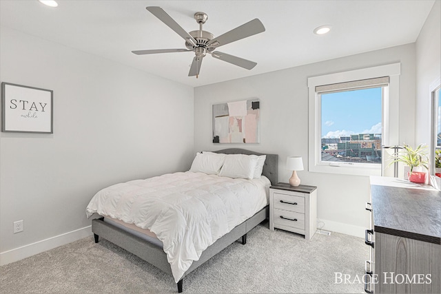 bedroom featuring baseboards, recessed lighting, a ceiling fan, and light colored carpet