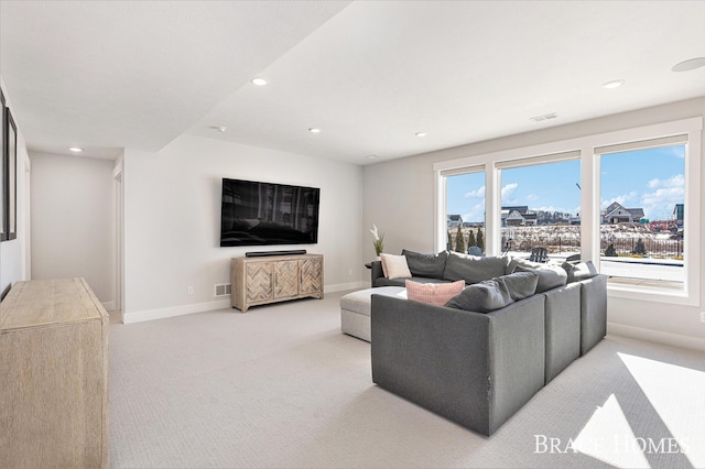 living area featuring carpet floors, baseboards, visible vents, and recessed lighting