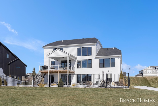 back of house featuring a balcony, a patio area, fence, and a yard