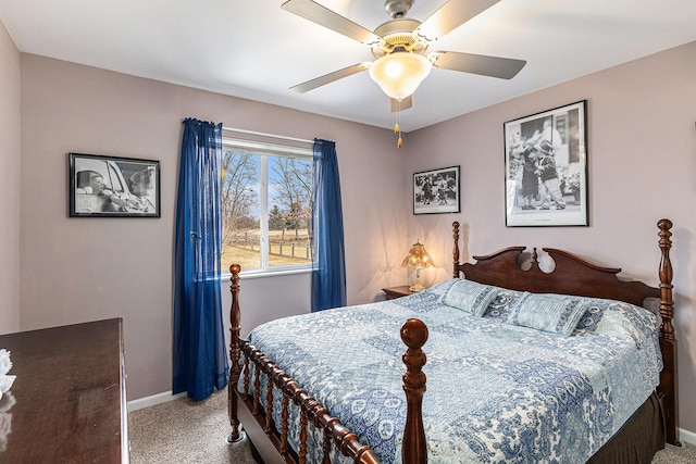 carpeted bedroom with a ceiling fan and baseboards