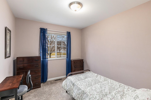 bedroom featuring carpet, visible vents, and baseboards