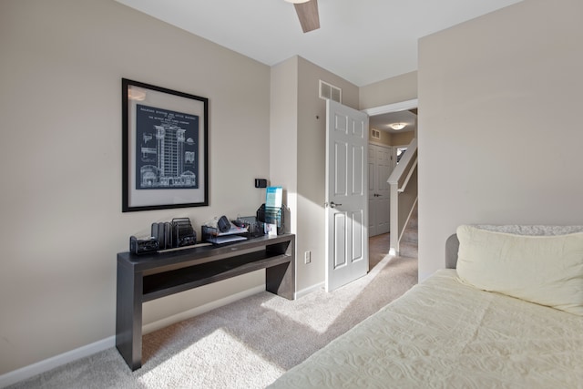 bedroom featuring a ceiling fan, carpet flooring, visible vents, and baseboards