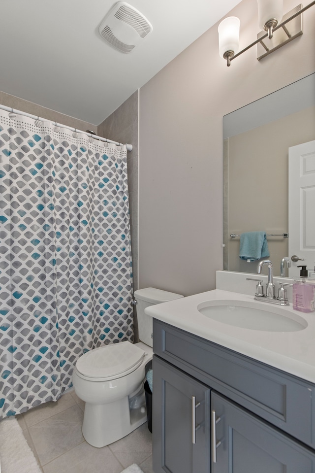 full bathroom featuring curtained shower, tile patterned flooring, toilet, vanity, and visible vents