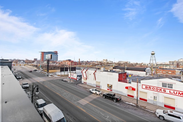 view of road with sidewalks and a city view