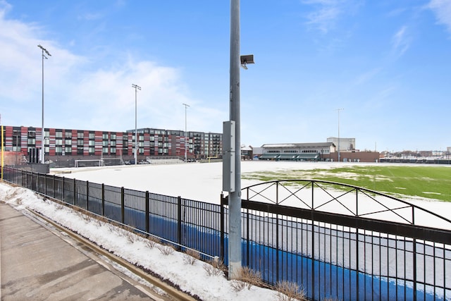 view of home's community featuring fence