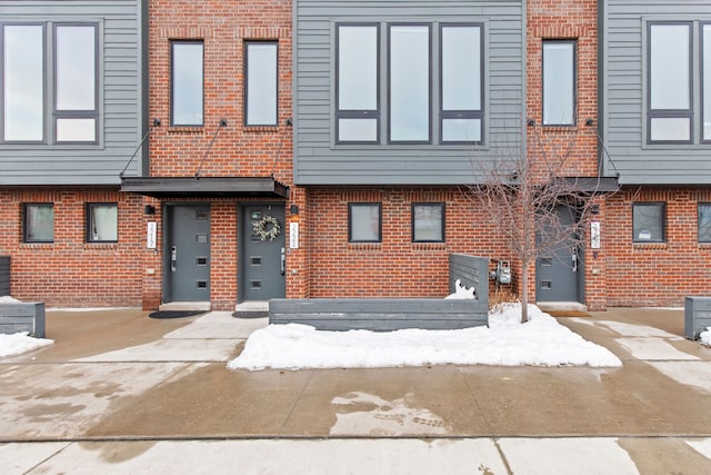 view of front of property featuring brick siding