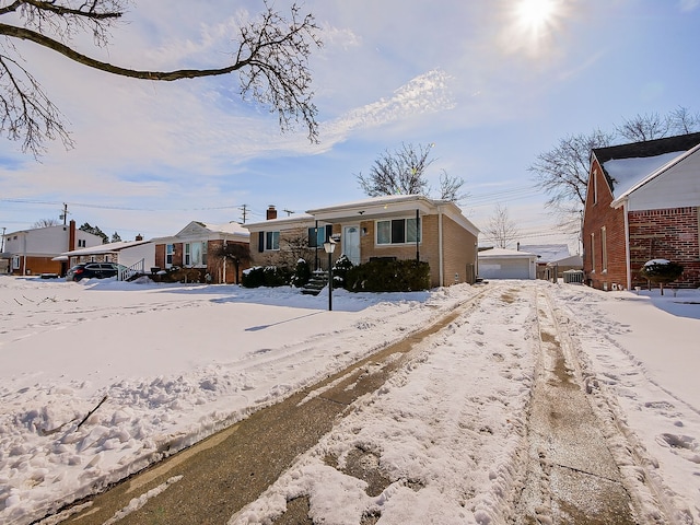 view of front of home featuring a garage and brick siding