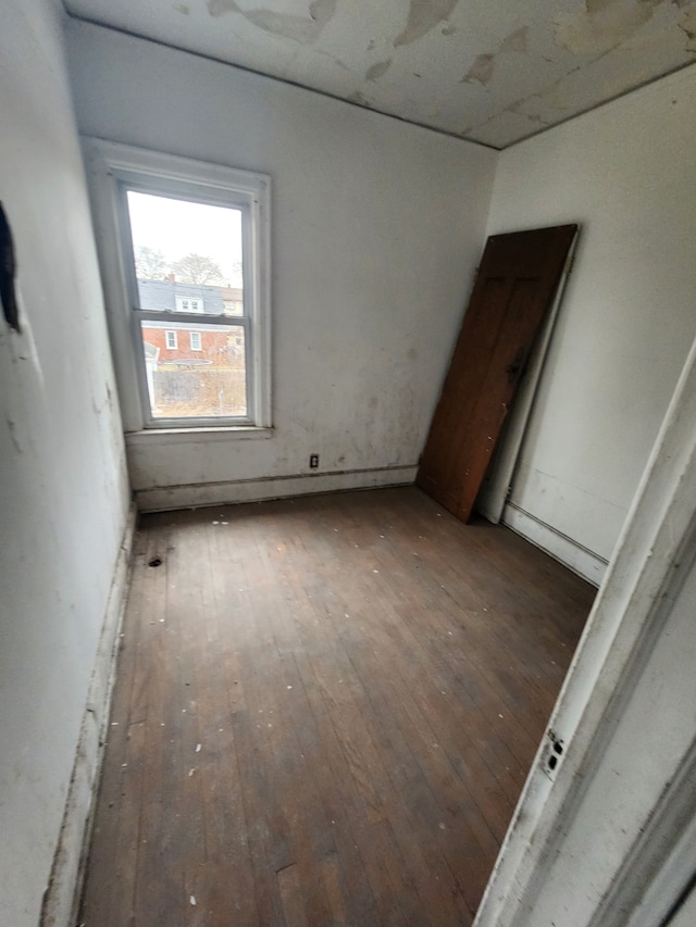 empty room with wood-type flooring