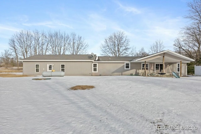 back of property featuring covered porch