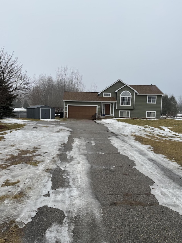 view of front facade with driveway and an attached garage